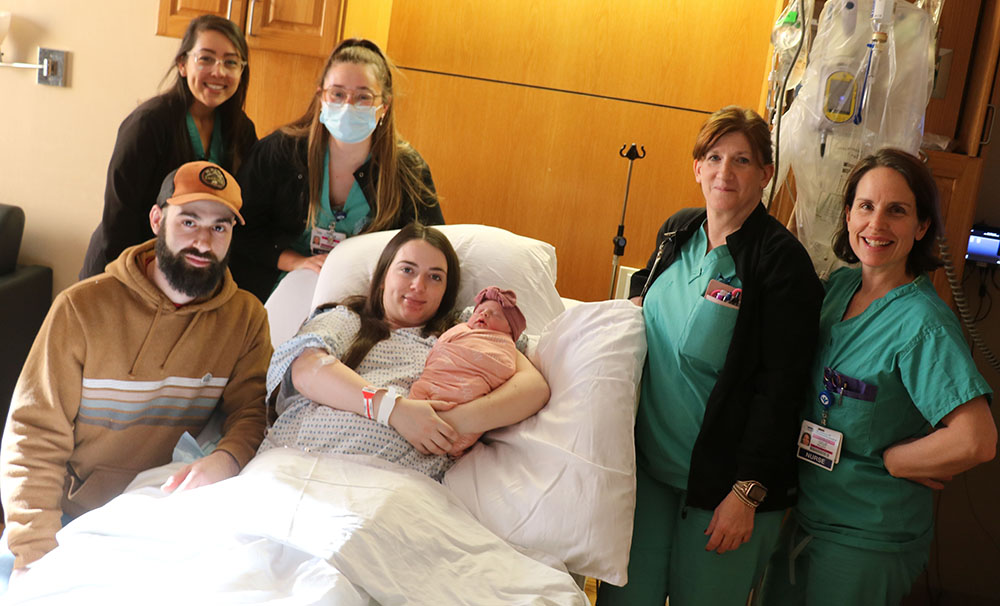 Abigail and Cory Nicholson hold baby Cali Quinn with St. Anthony Community Hospital Maternity Services Staff