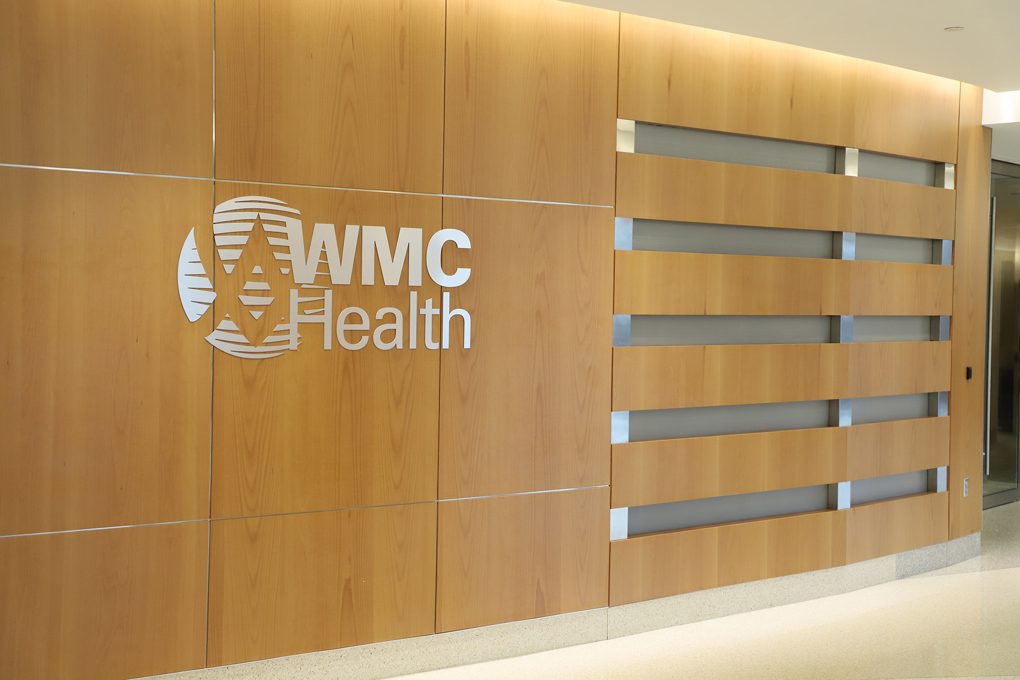 An interior view of a WMC Health system center with logo displayed