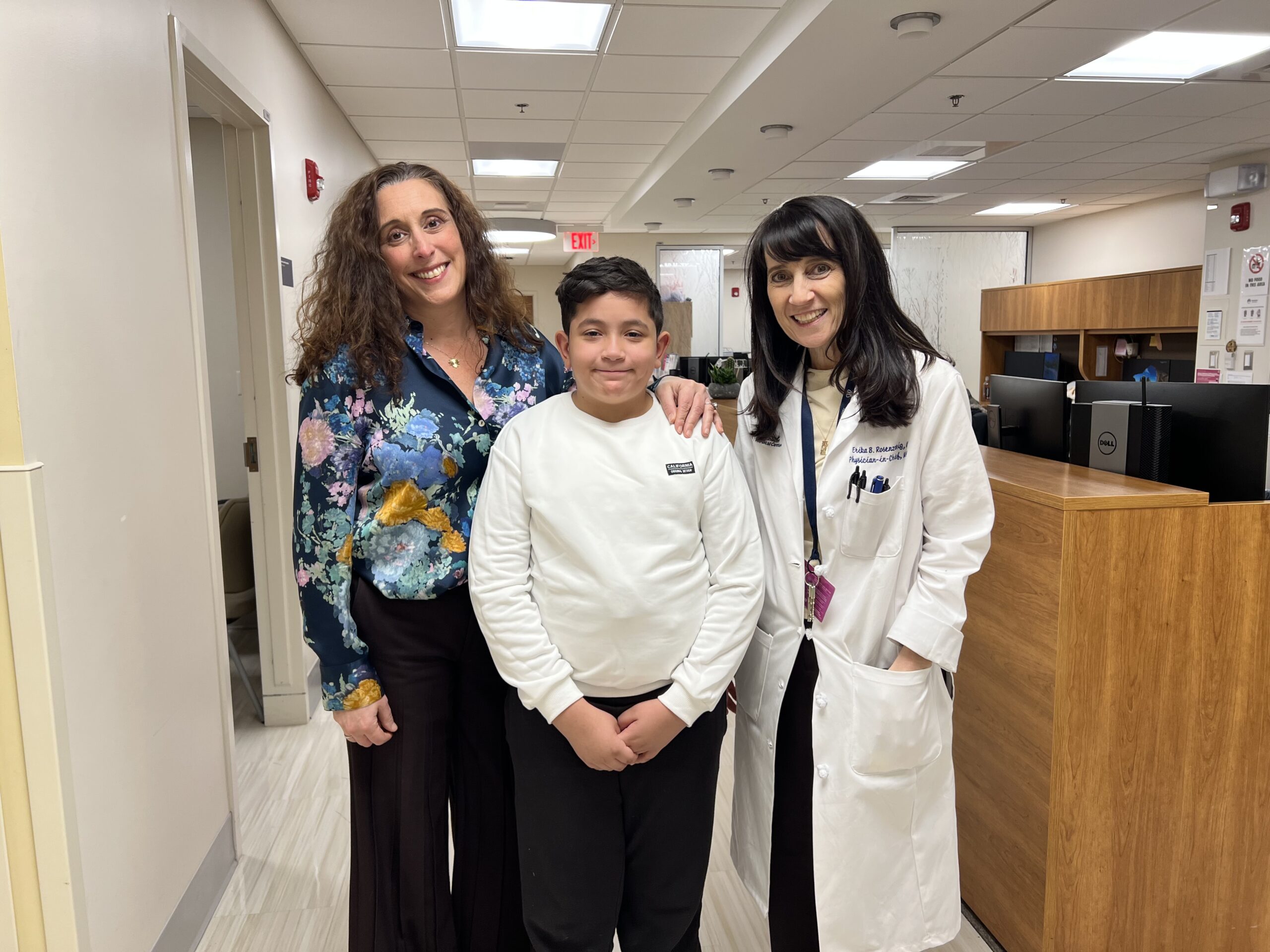 Mason with his mother, Jennifer, and Erika Berman Rosenzweig, MD pose at Maria Fareri Children's Hospital