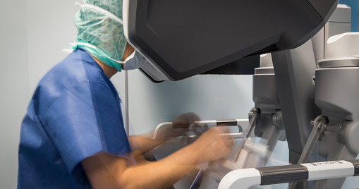 A surgeon performing a robotic surgery.