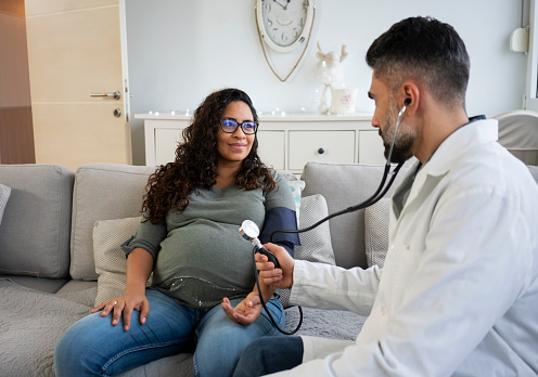 Doctor visit pregnant woman at home